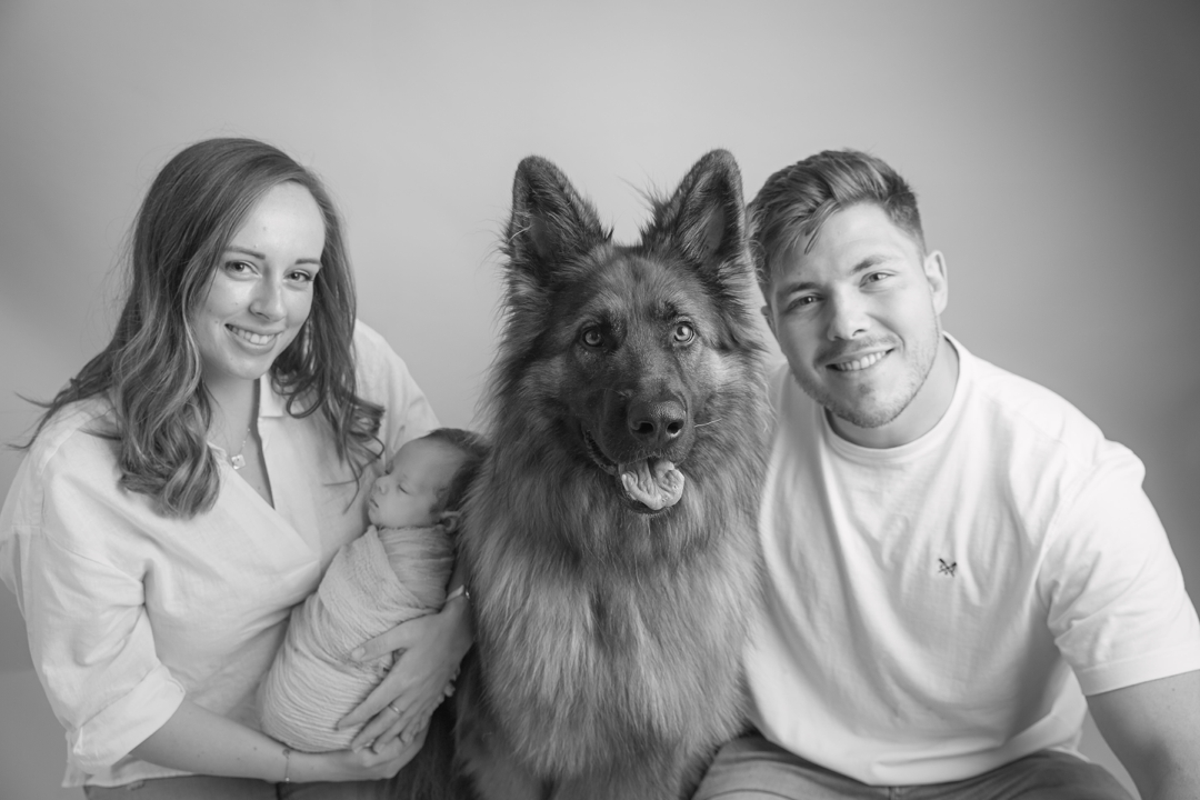 Newborn Photography family photograph of mum, dad and baby in black and white